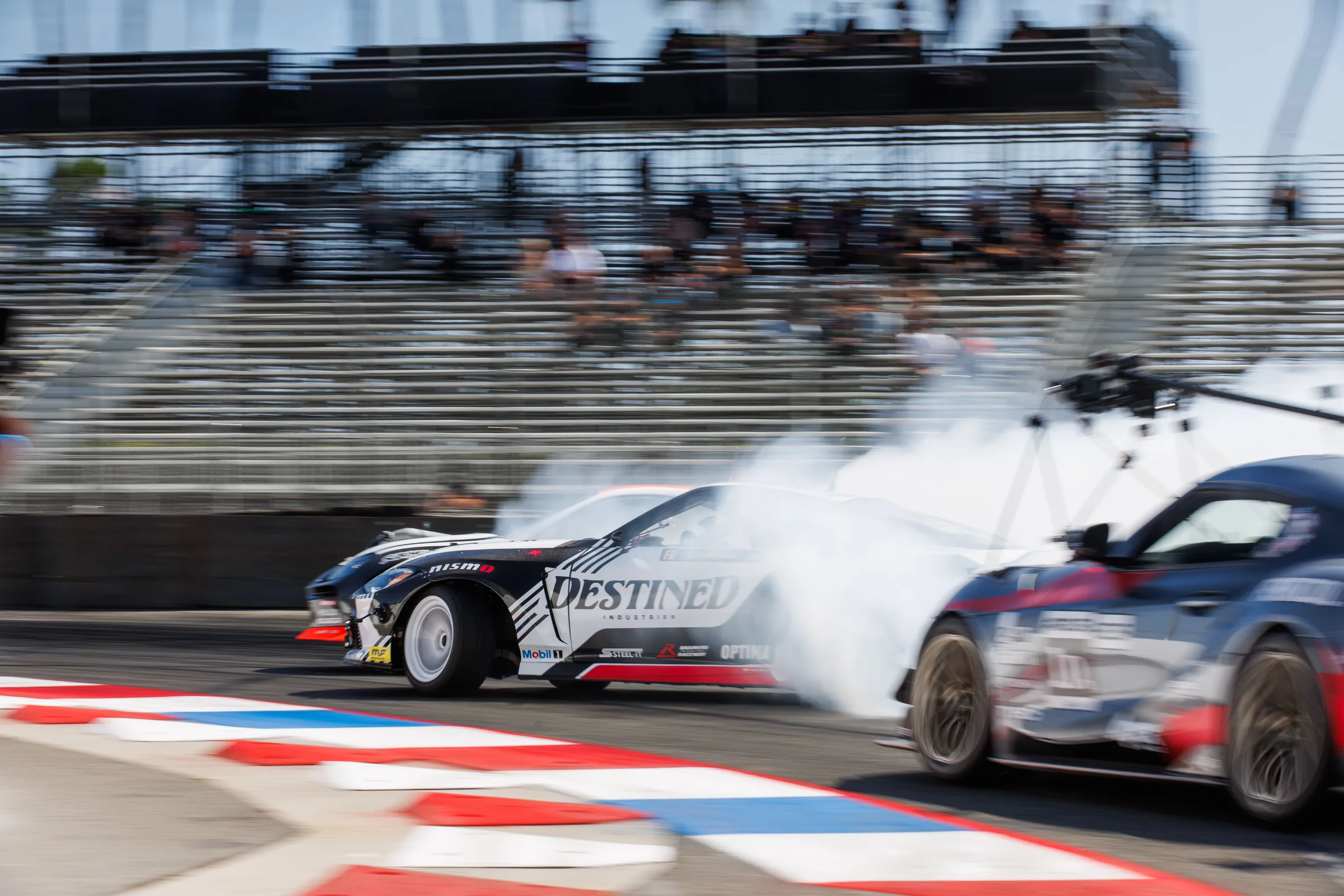 Tandem drift with crowd in stands